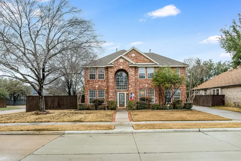 Brick home with a front lawn